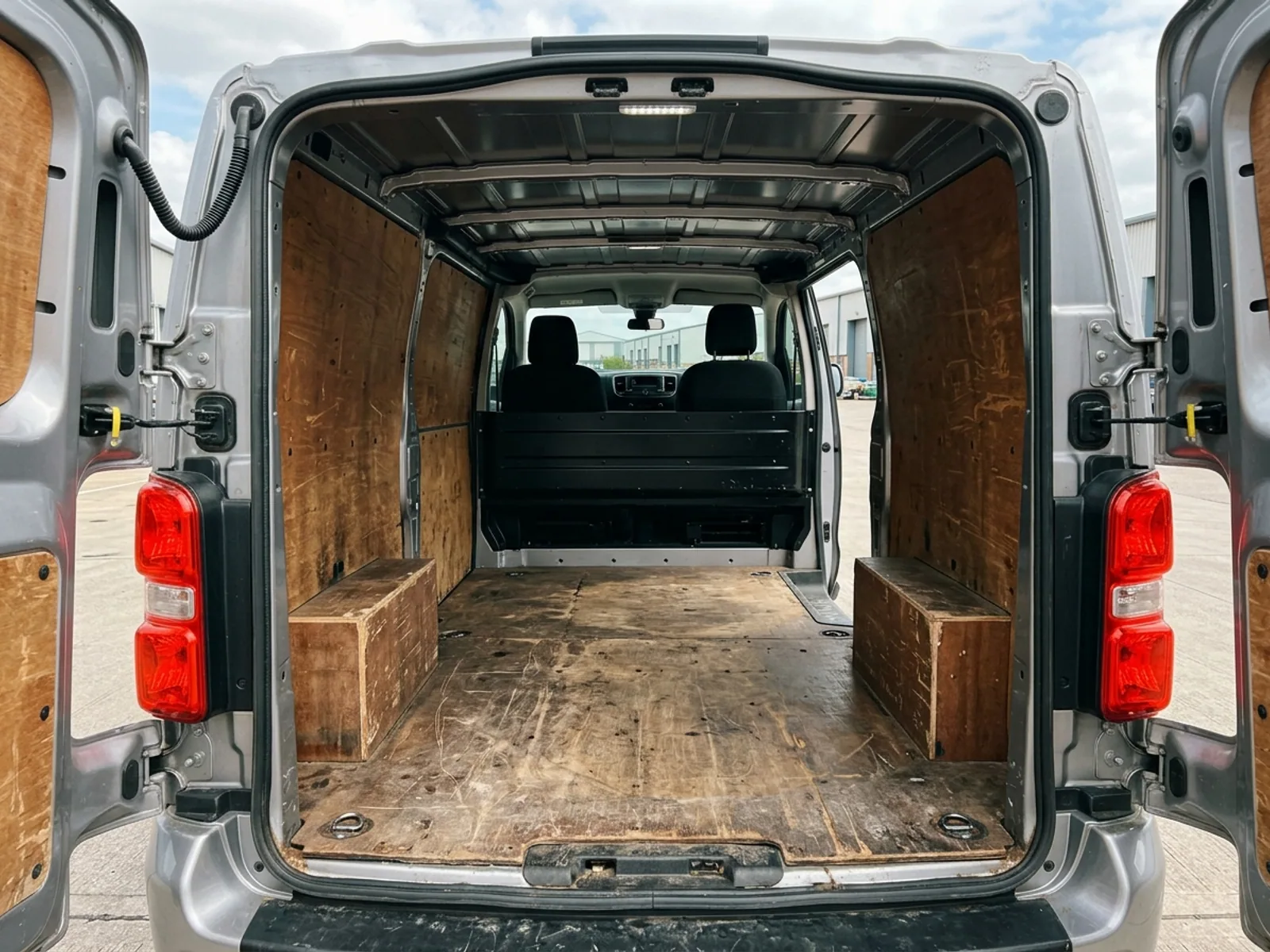 2021 Vauxhall Vivaro L2 panel van, load bay through the open rear doors, ply lined
