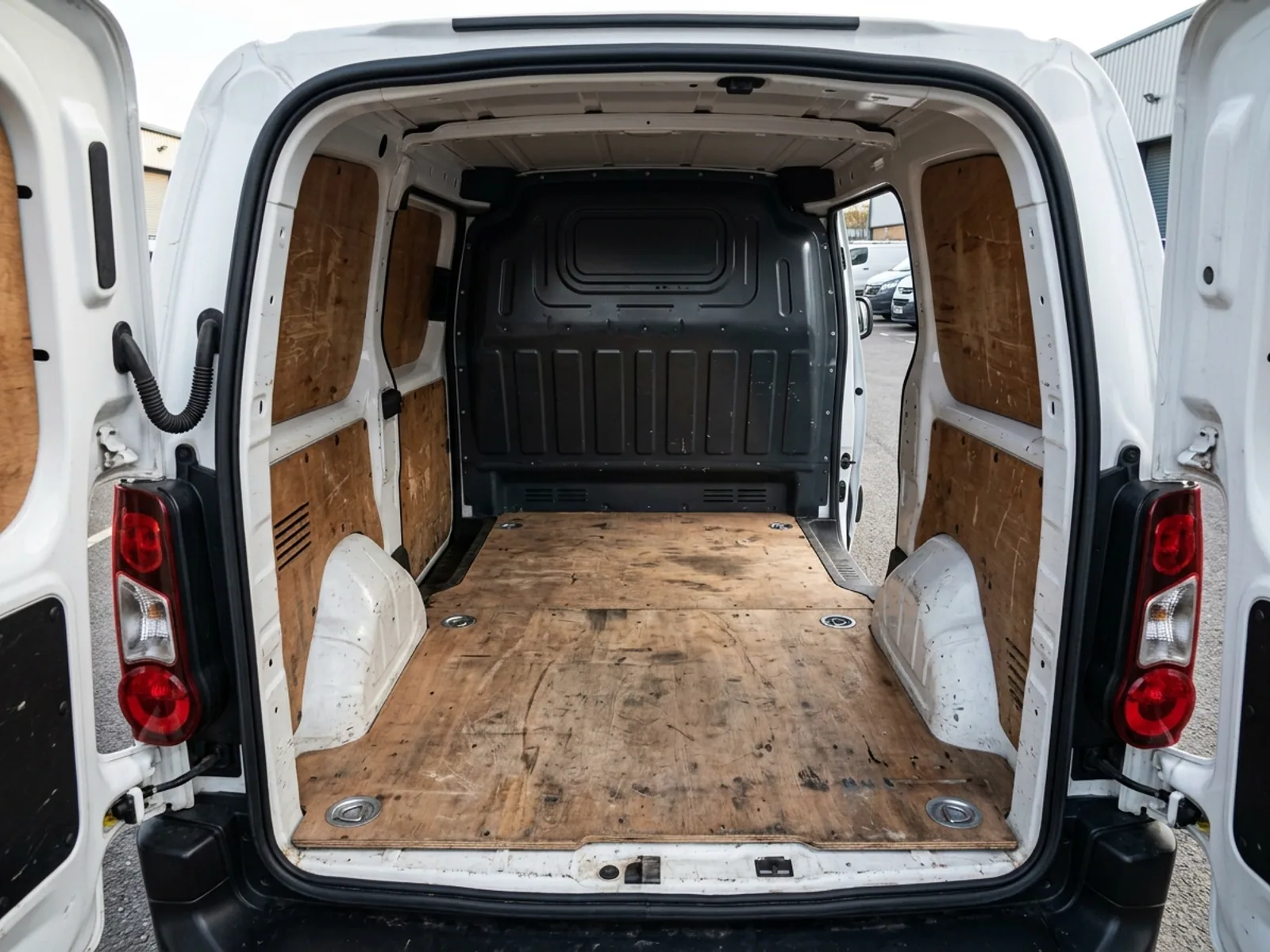 2020 Peugeot Partner L1 van, load bay through the open rear doors, ply lined